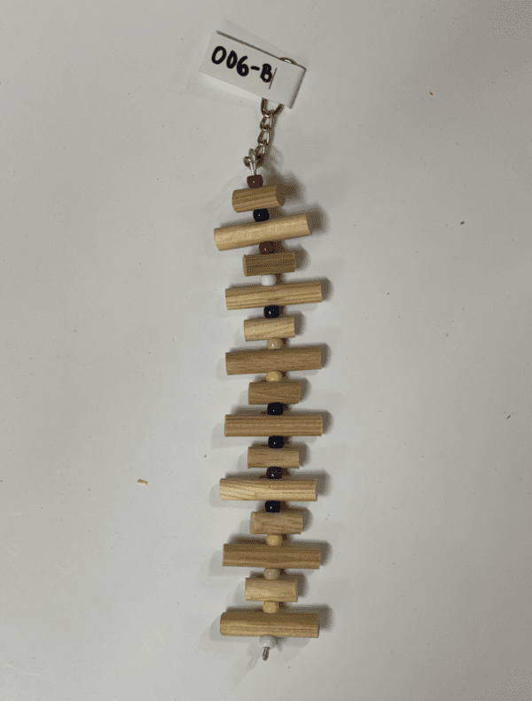 A Little Wood Stacks (Natural) necklace with a chain attached to it.
